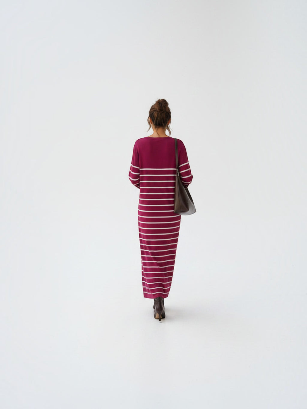 BROCK EMMA & ASHLEY long striped maxi dress with V-neck, worn by a woman with a brown leather shoulder bag