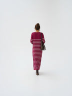 BROCK EMMA & ASHLEY long striped maxi dress with V-neck, worn by a woman with a brown leather shoulder bag