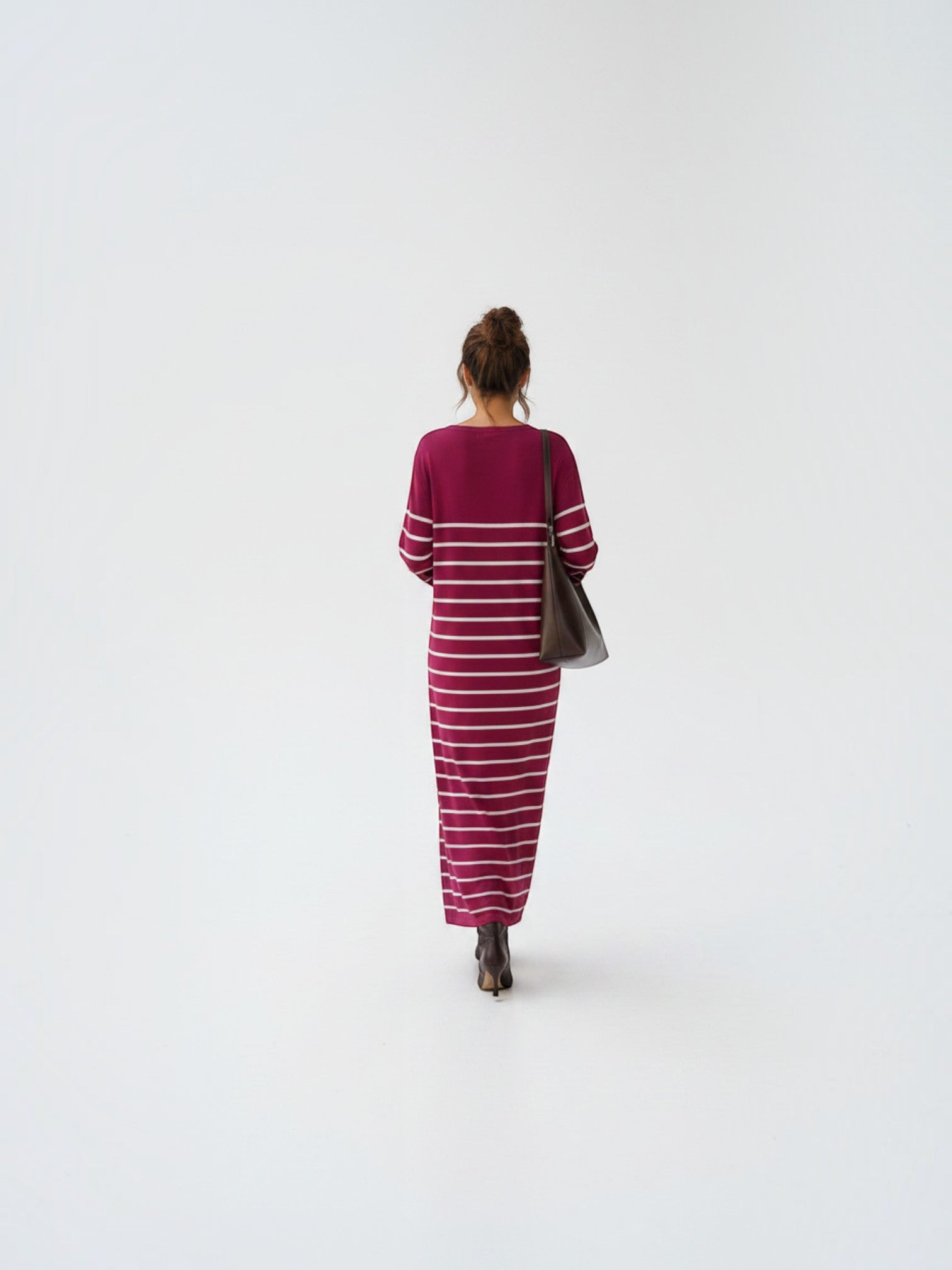 BROCK EMMA & ASHLEY long striped maxi dress with V-neck, worn by a woman with a brown leather shoulder bag