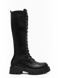 BROCK ERYNN black knee-high lace-up boots with metal eyelets and a thick lug sole for a rock-inspired winter look.