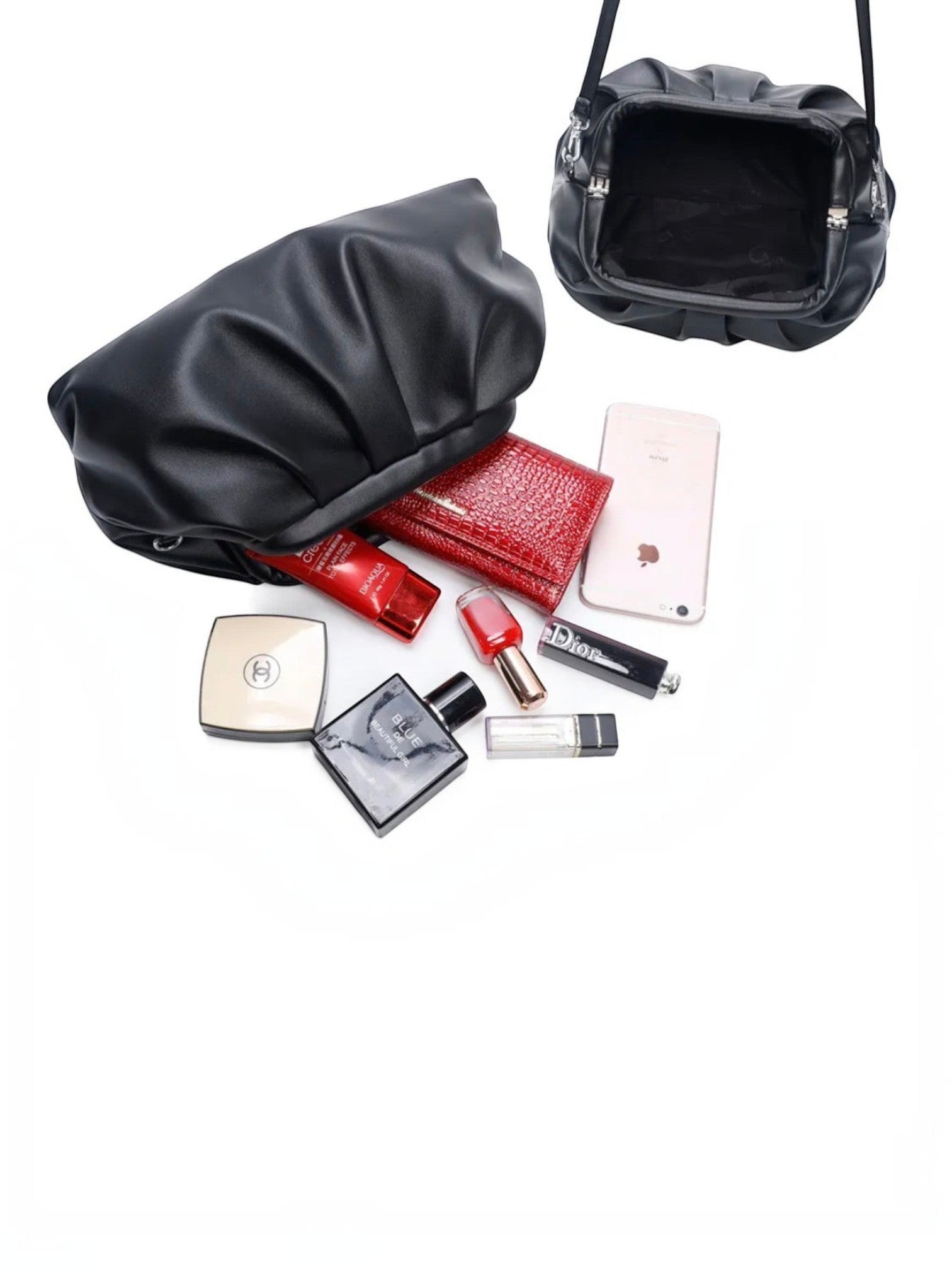 BROCK GALLANTRY black faux leather ruched clutch bag with open interior and scattered personal accessories