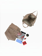 BROCK GALLANTRY Elyssa beige soft synthetic tote bag with open interior and accessories on a white background