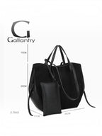 BROCK GALLANTRY Elyssa black synthetic tote bag with long shoulder straps, gold hardware, and detachable zip pouch.
