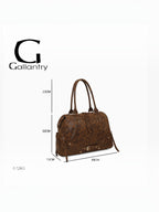 BROCK GALLANTRY Le Vespera brown synthetic bowling bag with vintage patina, gold hardware, and decorative buckles.
