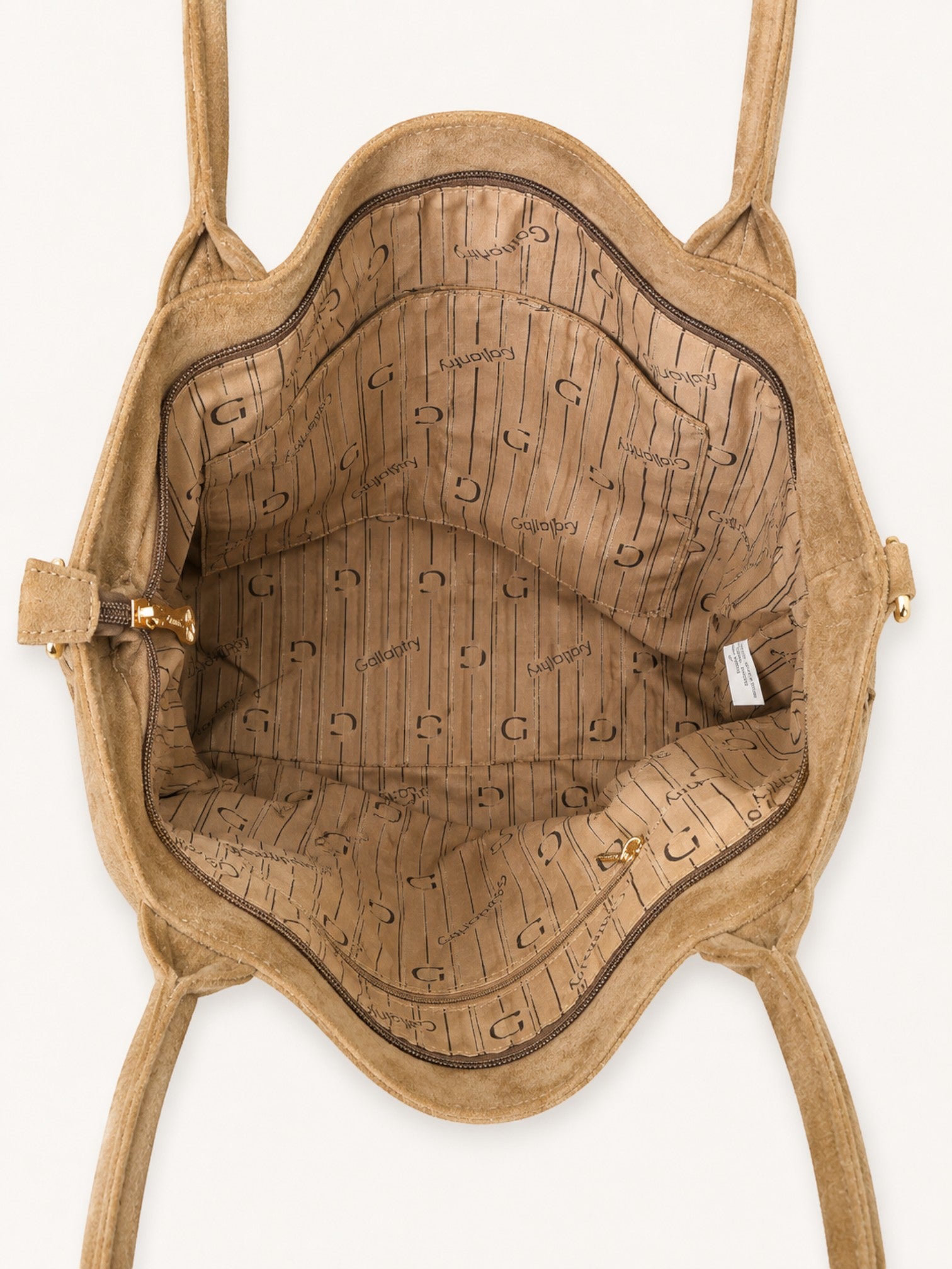 Interior view of a BROCK GALLANTRY beige synthetic suede handbag with branded lining and gold zipper details.