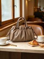 BROCK GALLANTRY taupe faux leather A4 handbag with gathered detailing, short handles, and a detachable strap.