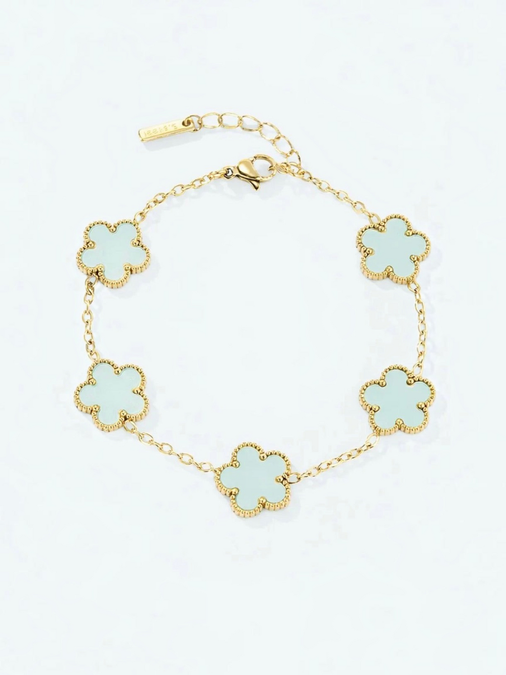 BROCK gold stainless steel bracelet featuring five light green flower charms with beaded edges