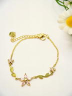 BROCK gold stainless steel chain bracelet with pink rhinestone flower and leaf charms and an extension chain