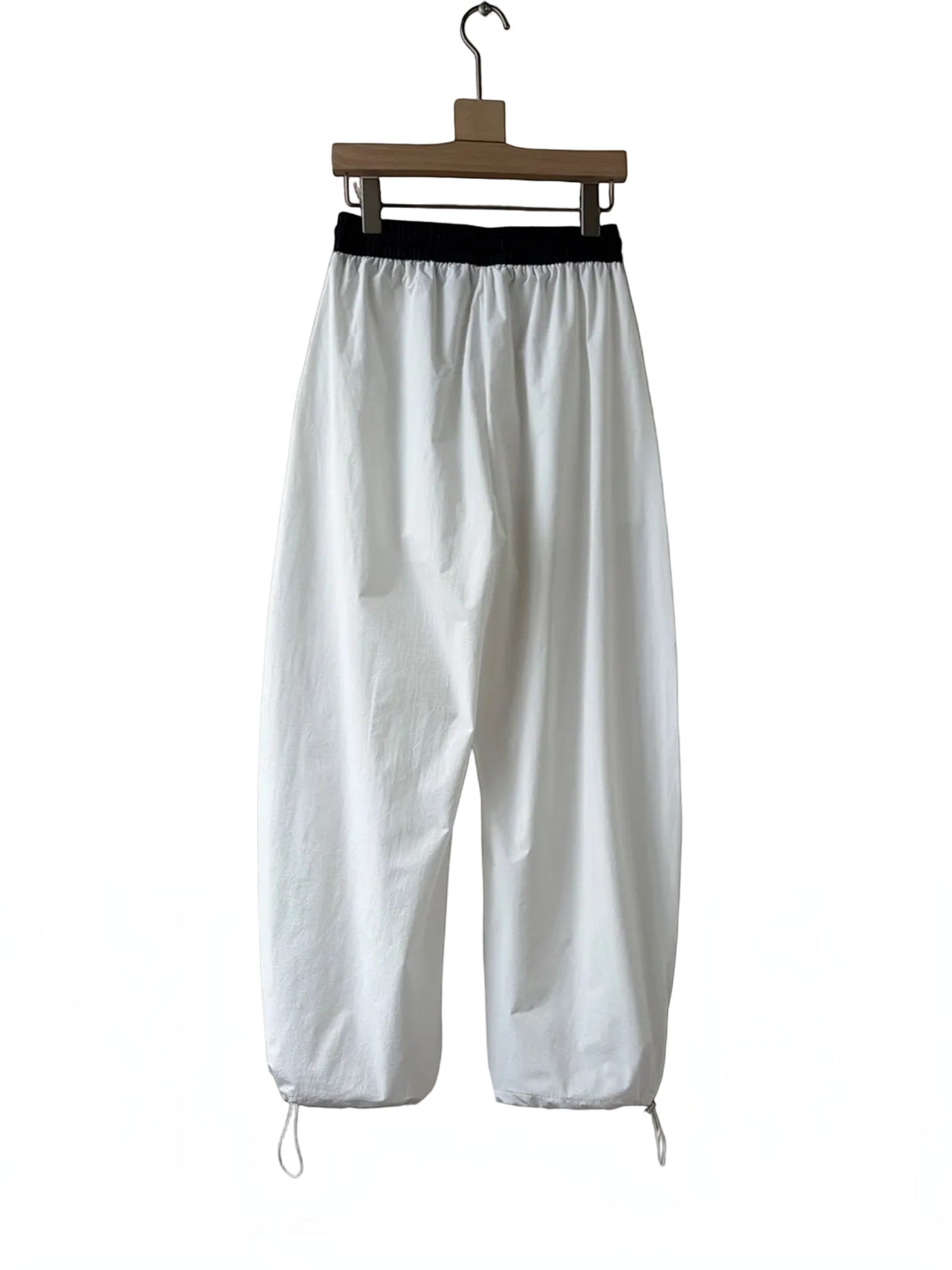 BROCK Golden days white wide-leg viscose trousers with a black elastic waistband and adjustable leg cuffs.
