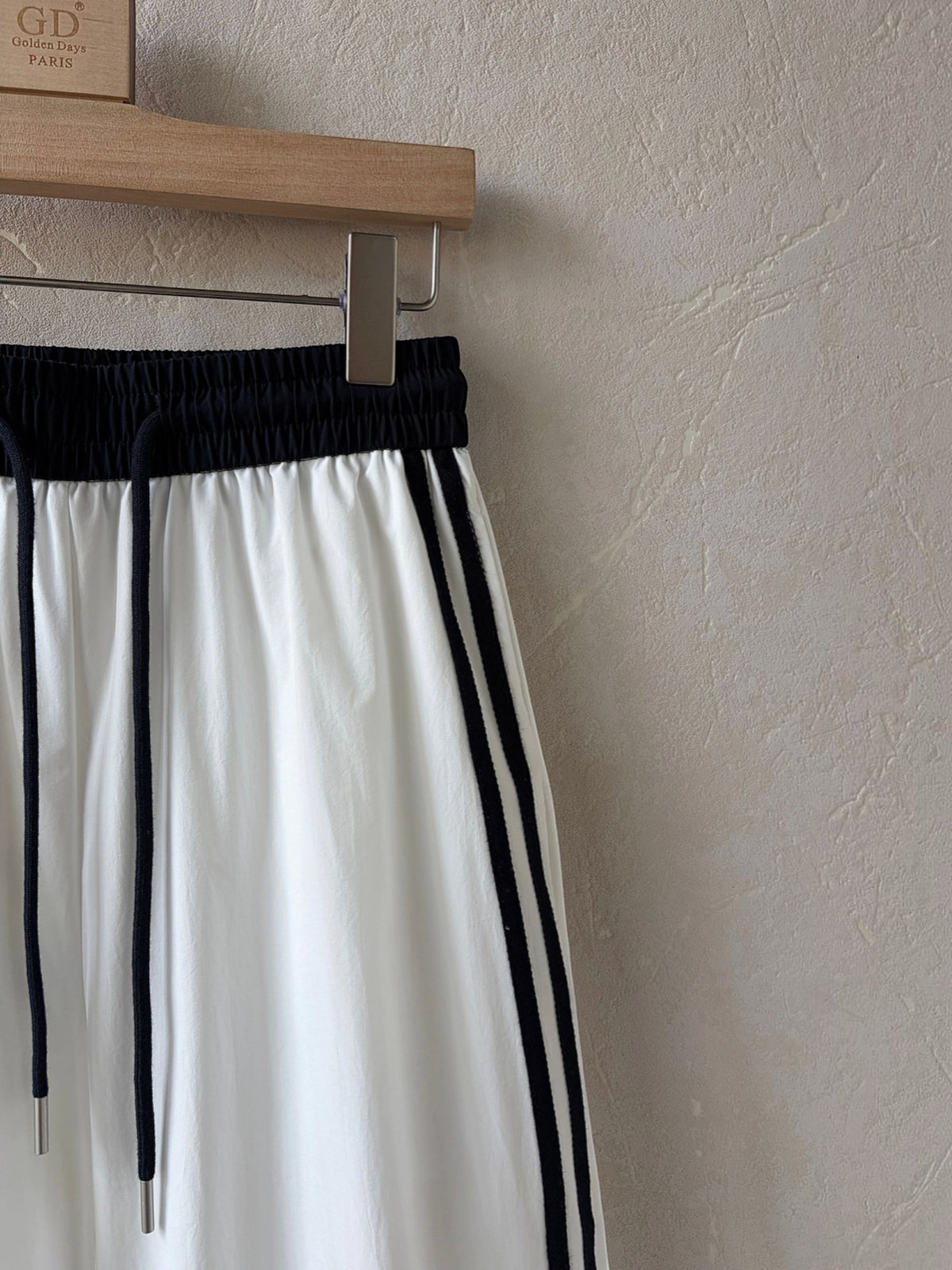 BROCK Golden days wide-leg trousers in white viscose with black side stripes and an elastic drawstring waist.