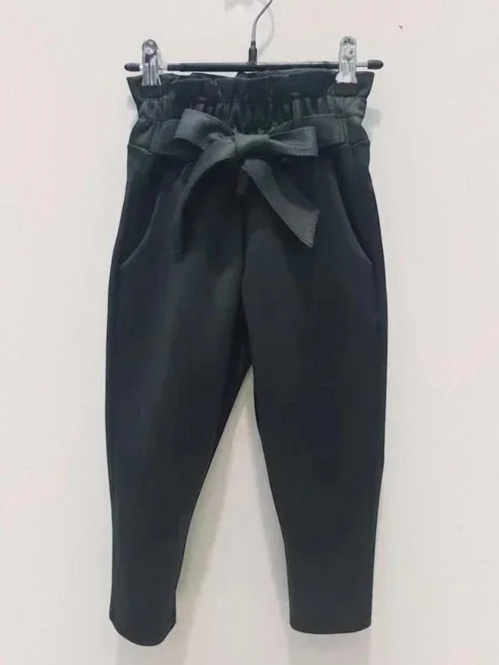 BROCK GRASSTAR children's black trousers with a high paperbag waist, tie belt, and comfortable stretch fabric.