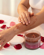BROCK GUAPA Beso Caliente white musk body scrub being applied to an arm, featuring a sugar-based exfoliating texture.