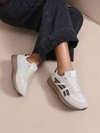 BROCK JOIA women's beige running lifestyle sneakers with contrasting panels and a lightweight sole worn with jeans