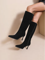 BROCK JOIA black synthetic high-heeled boots with a pointed toe and slim 8cm heel worn by a model