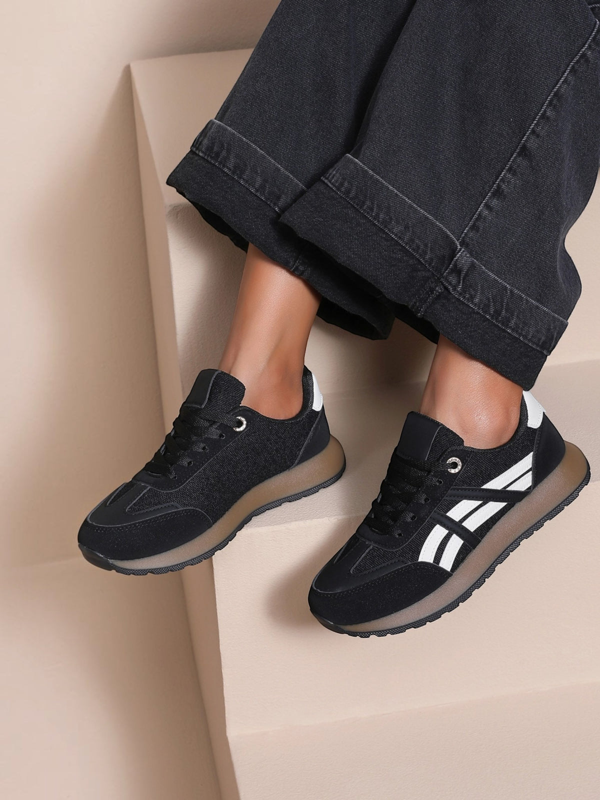 BROCK JOIA women's black running lifestyle sneakers with white side stripes and a lightweight translucent sole