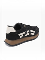 BROCK JOIA women's black and white running lifestyle sneakers with a thick gum sole and contrast panel design