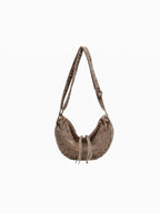 BROCK LINETA crescent-shaped crossbody bag in brown denim-effect fabric with adjustable strap and drawstring detail
