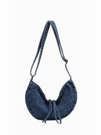 BROCK LINETA blue denim effect crossbody bag with a crescent shape and adjustable shoulder strap