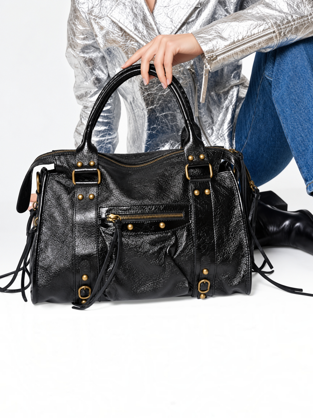 BROCK LOUISA LEE Capucine L black iridescent leather handbag with braided handles, fringe details, and gold studs.