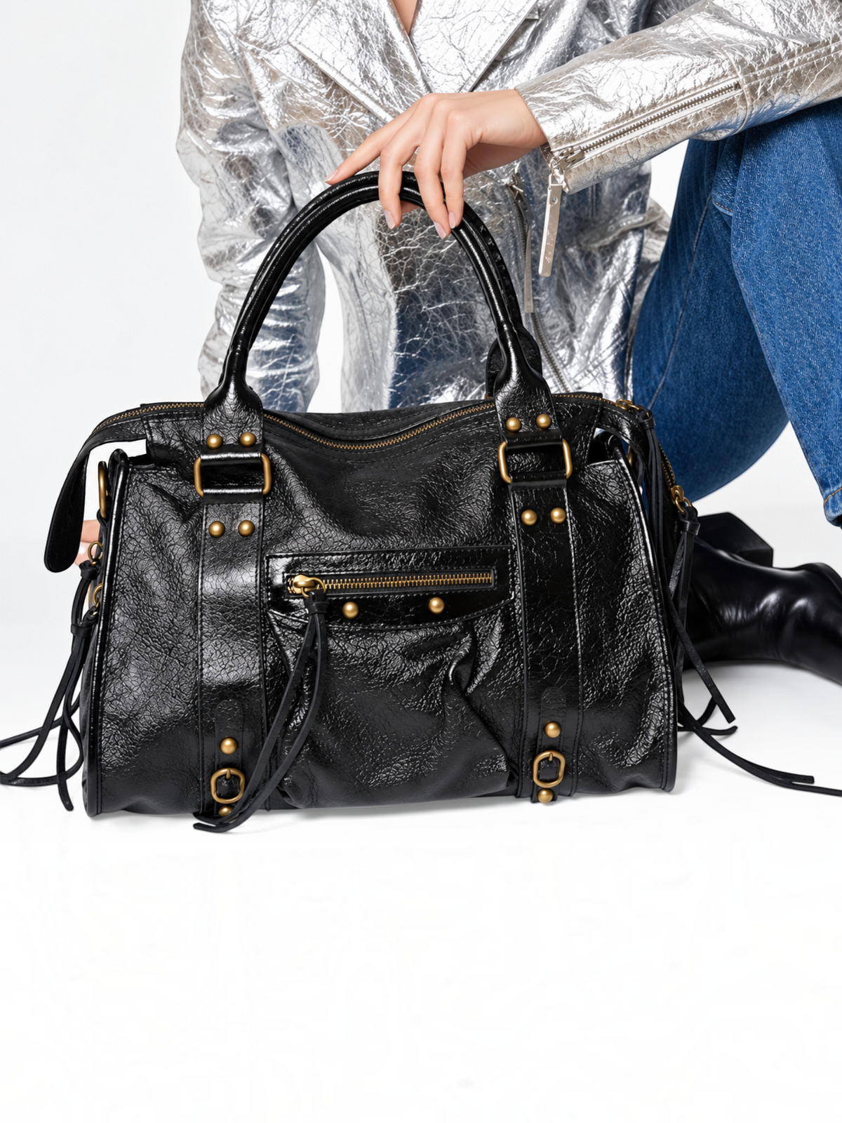 BROCK LOUISA LEE Capucine L black iridescent leather handbag with braided handles, fringe details, and gold studs.