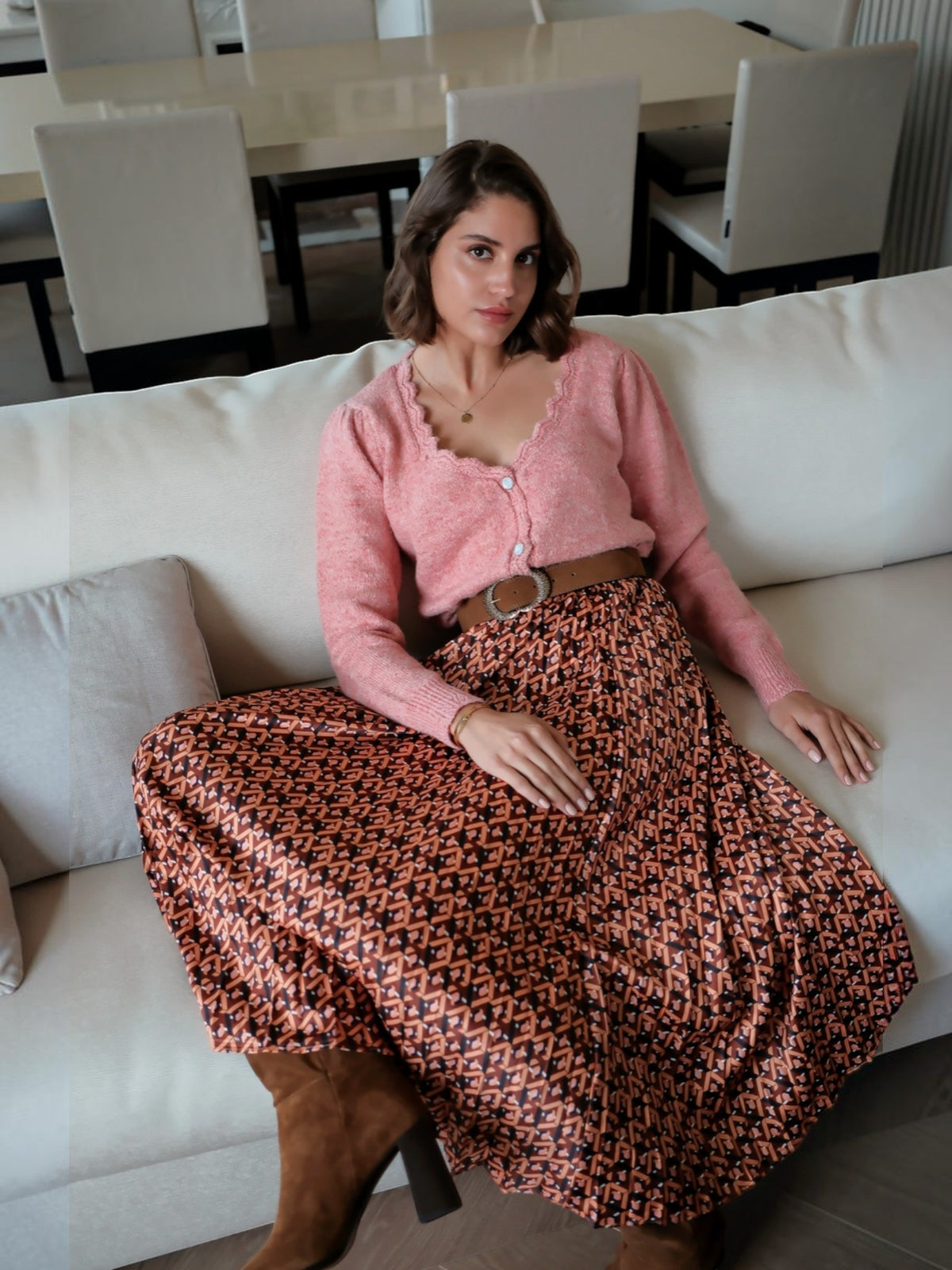 BROCK LOVIE & CO long pleated satin-effect skirt with geometric print worn by a woman with a pink cardigan