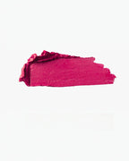 BROCK matte lipstick swatch in a vibrant deep pink shade with a smooth, creamy texture.