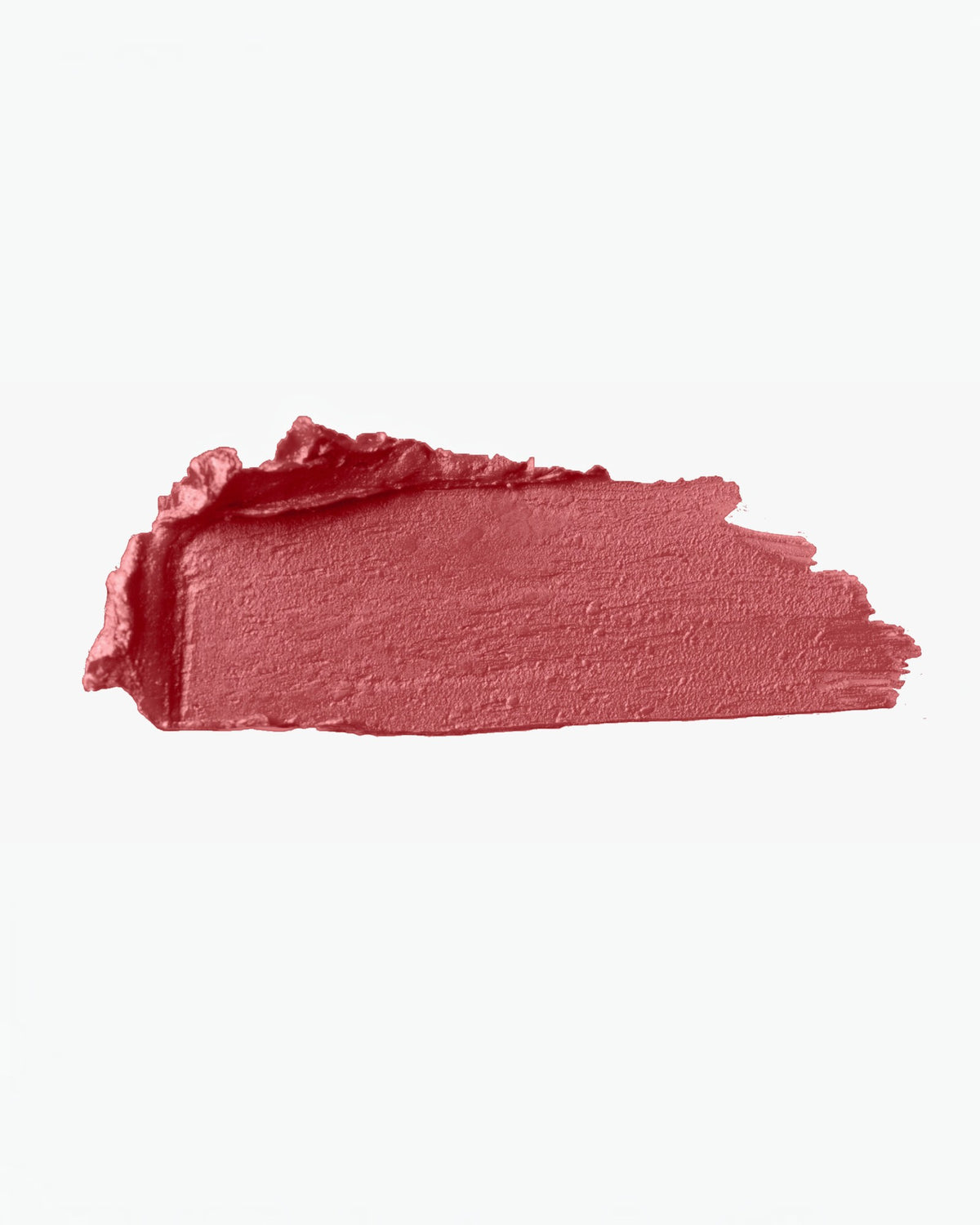 Swatch of matte red lipstick from BROCK, showing a creamy, pigmented texture on a white background.