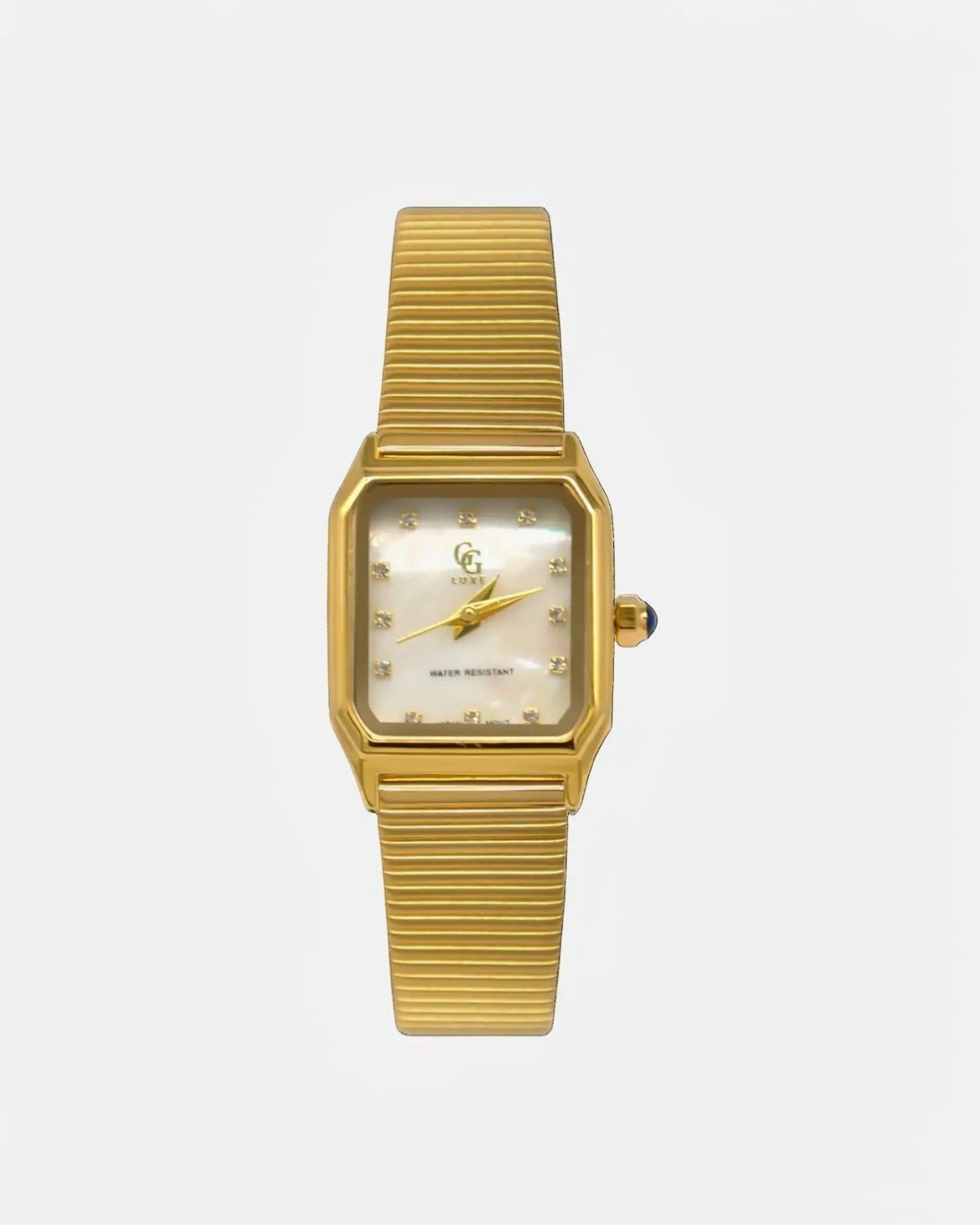 Montre Marlow GG LUXE WATCH dorée avec cadran rectangulaire nacré, index cristaux et bracelet mesh. Élégance rétro.