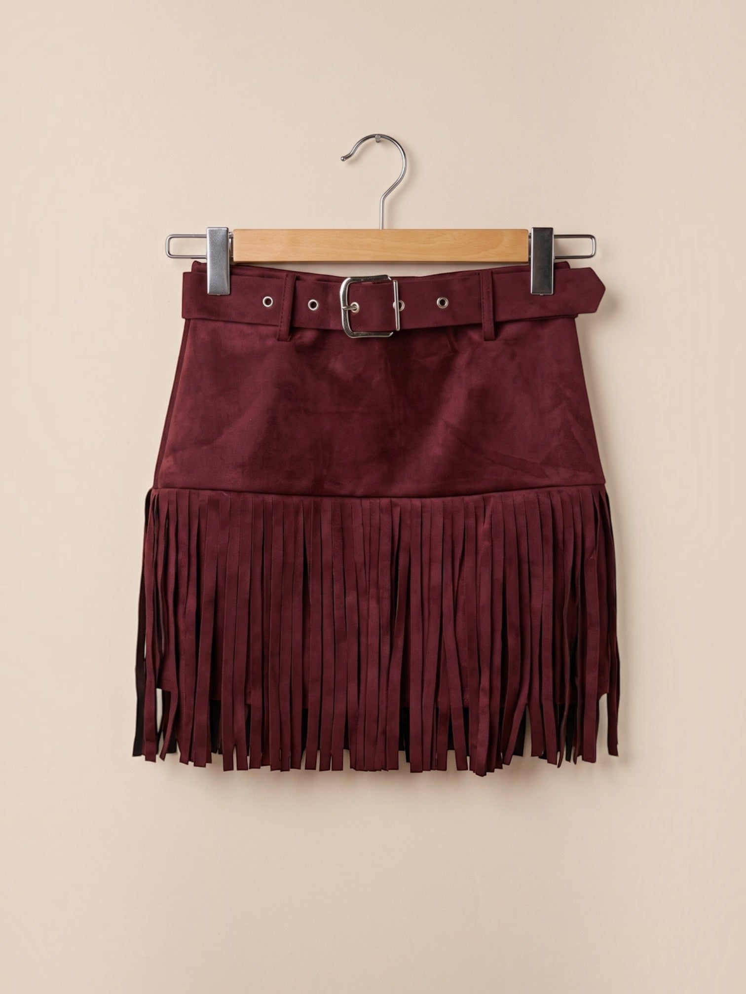 BROCK MOOYA burgundy faux suede mini skirt with fringe hem and matching belt featuring a silver metal buckle