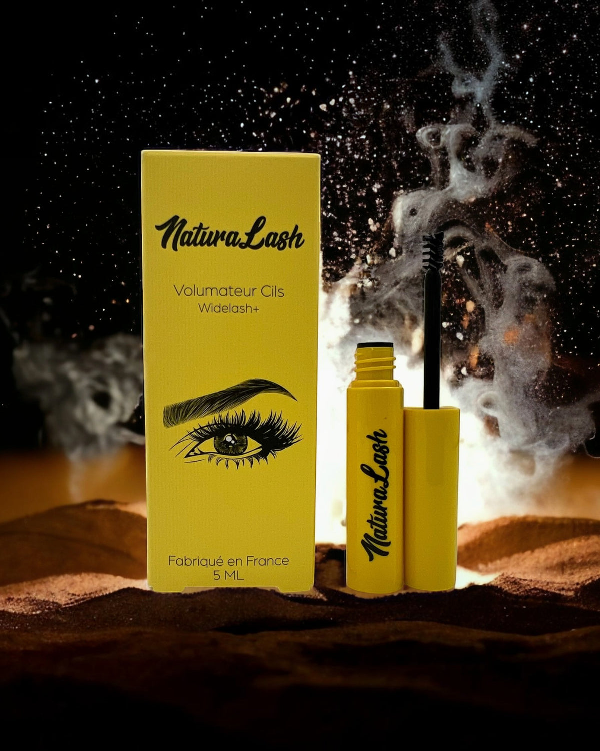 BROCK NATURALASH volumizing eyelash serum in a yellow bottle and box with a brush applicator against a dark background