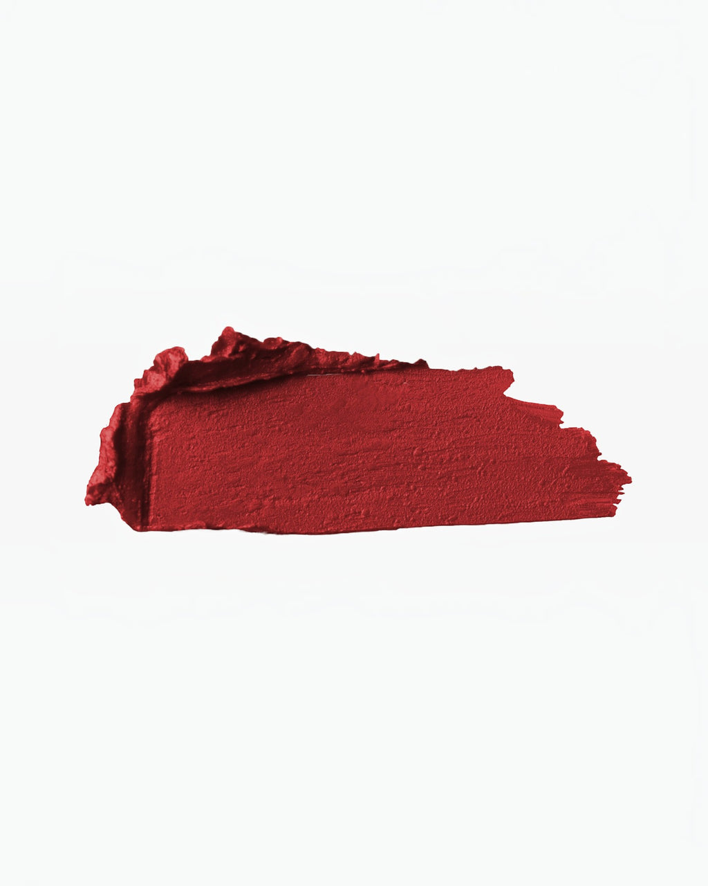 A rich red matte lipstick swatch from BROCK, showing intense pigmentation and a smooth, creamy texture.