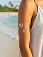 BROCK Rosa silver stainless steel armlet bracelet with a minimalist spiral design worn on a beach.