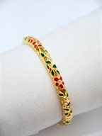 BROCK ROSA Thai-inspired gold brass bangle bracelet with red and green floral enamel and crystal accents.