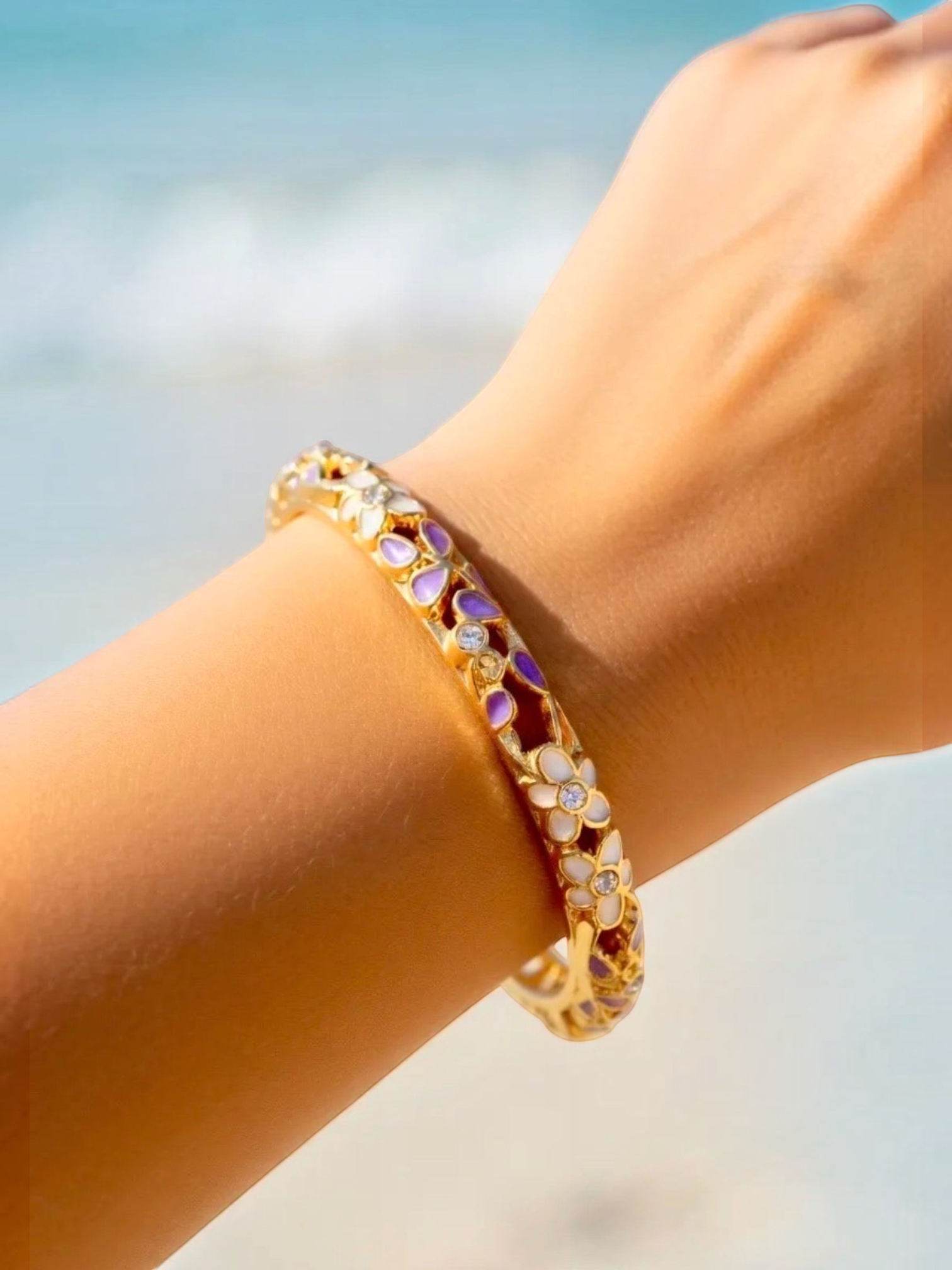 BROCK ROSA Thai-inspired brass bangle bracelet featuring delicate floral enamel details and sparkling crystals