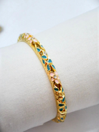 BROCK ROSA Thai-inspired gold brass bangle bracelet featuring delicate pink and blue floral enamel and crystal accents