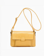 Sac bandoulière jaune en PU INES DELAURE de BROCK avec fermeture zippée et rabat, idéal pour le quotidien.
