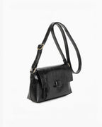 Sac bandoulière noir en PU INES DELAURE avec fermeture zippée et rabat, idéal pour un usage quotidien.