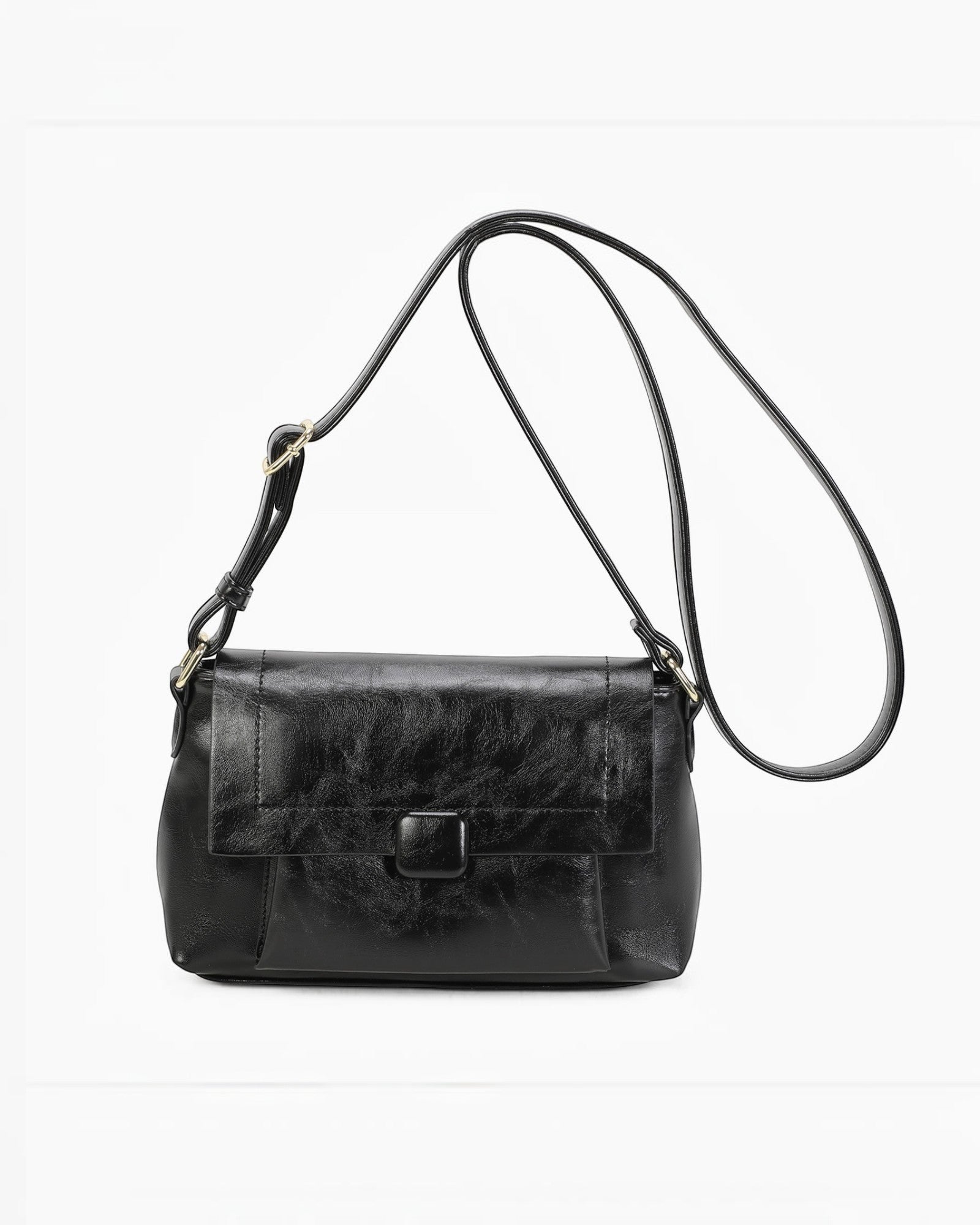 Sac bandoulière noir en PU INES DELAURE avec fermeture zippée et rabat, idéal pour un usage quotidien.