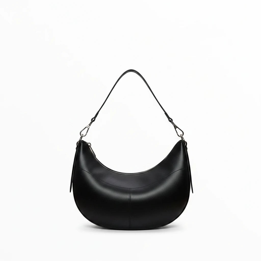 Sac épaule demi-lune BROCK LOUISA LEE en cuir de vachette lisse noir avec bandoulière ajustable et détails argentés.