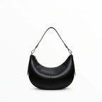 Sac épaule demi-lune BROCK LOUISA LEE en cuir de vachette lisse noir avec bandoulière ajustable et détails argentés.
