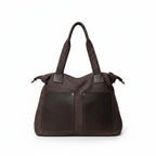 Sac à main BROCK en cuir marron avec texture tressée, deux poches frontales lisses et anses élégantes.