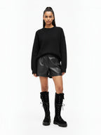 BROCK STEPHAN PARIS black suede lace-up biker boots with thick lug soles and decorative pockets on a model