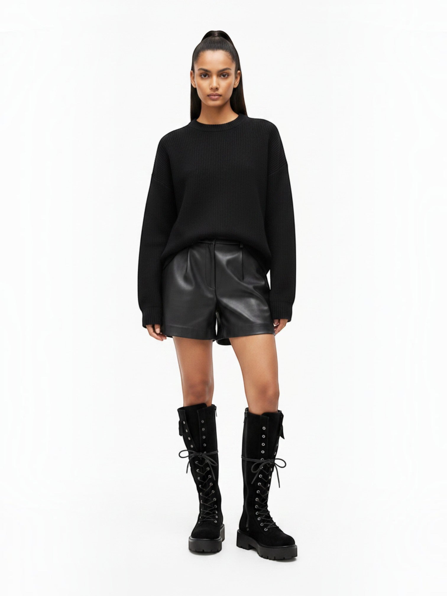 BROCK STEPHAN PARIS black suede lace-up biker boots with thick lug soles and decorative pockets on a model