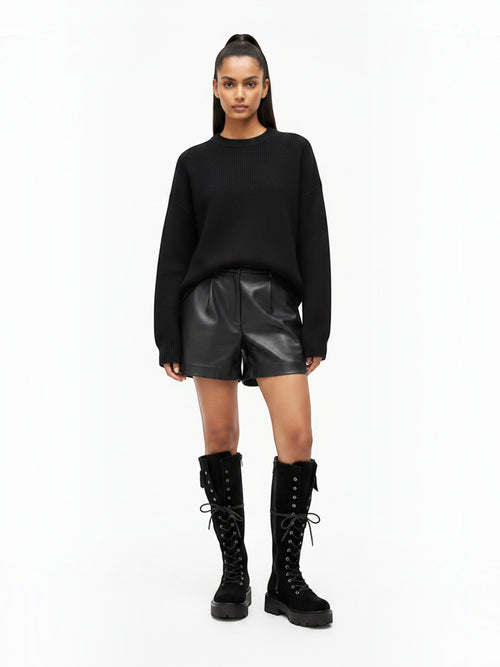 BROCK STEPHAN PARIS black suede lace-up biker boots with thick lug soles and decorative pockets on a model