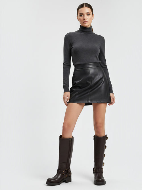 Model wearing BROCK STEPHAN PARIS brown leather biker boots with multi-buckle straps and block heels