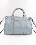 BROCK SYSTYLE light blue synthetic weekend travel bag with gold hardware, braided handles, and front zip pocket.