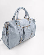 BROCK SYSTYLE light blue synthetic weekend bag with braided handles, gold metal hardware, and front zip pocket.