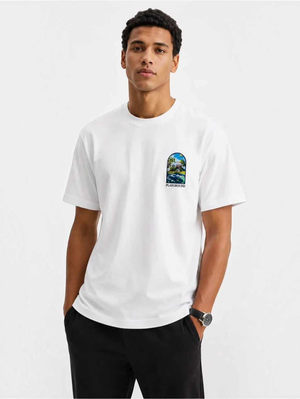 BROCK white cotton t-shirt with short sleeves and a small artistic graphic print on the chest, worn by a model.