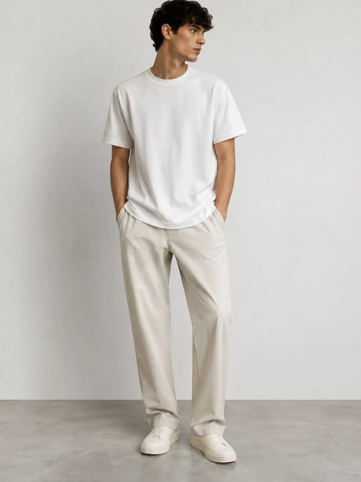 BROCK white cotton short-sleeve t-shirt with a relaxed fit worn by a male model with beige trousers