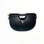 Sac à main noir Design GALLANTRY en simili cuir avec anse rigide et fermoir doré.